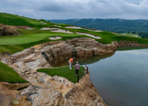 Wide view of the Top of the Rock golf course at Big Cedar Lodge from a cliffside vantage point — part of a Redd Golf resort offering.